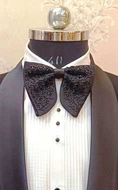 Suit up for your special occasion in my eye-catching satin bow tie with handwork of stone. I craft these by hand to my unique design using the finest quality n.blue satin & handwork material used very precious and they are just PERFECT for proms and black tie events. This satin bow tie is completely hand-stitched & hand crafted and has been created using finest silk thread and a slider so that it is fully adjustable to a perfect fit. It will accommodate a collar of any size between 14" and 19" as standard. If you need it in a larger size just let me know your collar measurement and I can make the strap longer for you. Getting married? These bow ties make for a very dapper groom and groomsmen! The item is made to order and is usually ready to dispatch in 4-8 business days, however if you ne Dapper Grooms, Black Tie Events, Hands To Myself, Satin Hands, Designer Suits For Men, Suit Up, Black Tie Event, Groom And Groomsmen, Satin Bow