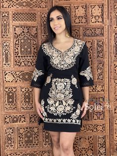 This Beautiful Floral Golden Embroidered Dress is the perfect formal dress. It's embroidered from top to bottom with gold florals and has details in lace and crochet. It also has ties in the back of the dress for a tighter look if desired. Please Note: You may purchase the dress with a belt for a special price or you can purchase the dress without the belt. The accessories you can buy and find in this link https://www.etsy.com/es/listing/637147293/filigrana-redonda-filigrana-clasica?ref=shop_hom Fitted V-neck Dress With Embroidered Neckline, Traditional Fitted Dress With Gold Embroidery, Fitted Embroidered Tunic Dress In Traditional Style, Fitted Traditional Embroidered Tunic Dress, Festive Embroidered Tunic Dresses, Elegant Tunic Dress With Embroidered Neckline, Elegant Dresses With Resham Embroidery And Short Sleeves, Festive Fitted Embroidered Tunic Dress, Fitted Dresses With Resham Embroidery