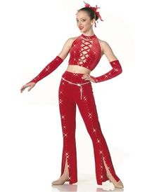 a woman in a red outfit is posing for the camera with her hands on her hips