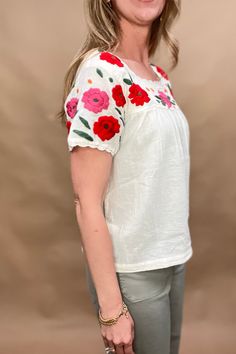 Indulge in elegance with our embroidered floral cotton blouse. Made from 100% lightweight cotton, this creamy white blouse boasts a square neckline and delicate embroidery, adding a touch of sophistication to any ensemble. Elevate your style with this exquisite piece. Fit: true to size, Amber is 5'6" modeling size XSmall. Content: 100% Cotton Delicate Embroidery, Cotton Blouse, Square Necklines, Cotton Blouses, White Blouse, Creamy White, Elevate Your Style, Ethical Fashion, Square Neckline