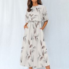 Introducing our "Boho Breeze" short sleeve midi dress - a perfect fusion of style and comfort. This dress boasts a crewneck design, short sleeves, and a flattering fit-and-flare silhouette that exudes bohemian charm. The 4-way stretch fabric, crafted from a blend of 95% polyester and 5% spandex, ensures optimal comfort and flexibility for all-day wear.  The regular fit and elastic waistband provide a tailored look while allowing for easy movement. With convenient pockets, this dress seamlessly c Casual Half-sleeve Maxi Dress For Beach, Casual Half Sleeve Maxi Dress For Beach, Casual Half Sleeve Maxi Dress For Vacation, Flowy Modest Midi Dress With Short Sleeves, Modest Flowy Midi Dress With Short Sleeves, Casual Printed Knee-length Midi Dress, Casual Knee-length Printed Midi Dress, Casual Short Sleeve Mini Dress For Vacation, Casual Printed Midi Dress With Half Sleeves