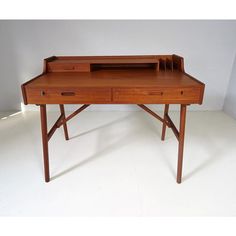 a wooden desk with two drawers on one side and an open drawer on the other