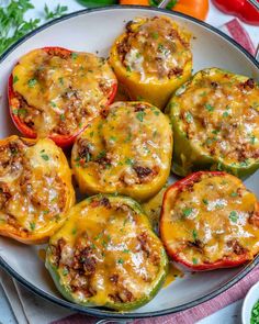 stuffed bell peppers with cheese and herbs in a white bowl