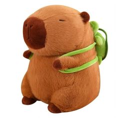 a stuffed animal with a green ribbon around its neck