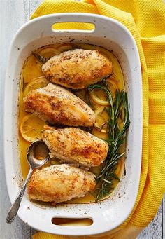 chicken with lemon sauce in a white casserole