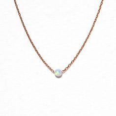 A classic necklace never goes out of style. Our Tiny Opal Necklace features a single opal pendant that has all the colors of the rainbow. Dainty Opal Pendant Necklace, Dainty Opal Round Pendant Necklace, Dainty Opal Birthstone Necklaces, Elegant Pink Opal Round Necklace, Opal Gemstone Round Pendant Necklace, Dainty Opal Clavicle Chain Necklace, Dainty Opal Collar Necklace, Minimalist Opal Pendant Jewelry, Opal Birthstone Necklaces