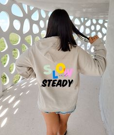 Slow and Steady - Hooodie women's hoodie, trendy sweatshirt, vsco hoodie, cute hoodies, oversized hoody, tumblr, positivity, quote Suggestion:  - Size up 1-2 full sizes for an oversized look A unisex heavy blend hooded sweatshirt is relaxation itself. The material is a thick blend of cotton and polyester. This makes for a plush, soft feel alongside warmth. It's also a great surface for printing. There are no side seams. A spacious kangaroo pocket hangs in front. The hood's drawstring is the same Trendy Relaxed Fit Sweatshirt, Trendy Oversized Sweatshirt With Drawstring Hood, Relaxed Fit Text Print Hoodie For Loungewear, Trendy Oversized Crew Neck Hoodie, Trendy Tops With Drawstring Hood, Trendy Relaxed Fit Sweatshirt For Everyday, Trendy Crew Neck Sweatshirt With Drawstring Hood, Everyday Relaxed Fit Hoodie With Letter Print, Oversized Trendy Sweatshirt With Letter Print