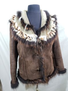 Lovely women's warm sheepskin coat made of natural fur. Stylish brown sheepskin coat with a wide multi-fur collar. Wonderful women's sheepskin coat with impregnation on the outside. Sheepskin coat is made of wonderful warm brown natural fur. The outer side of the sheepskin coat is sanded and impregnated to protect against water and has. Sheepskin coat is fastened with large plastic buttons. Sheepskin coat has two convenient front pockets. The sheepskin coat has a multi-fur wide collar sewn from several types of fur, thanks to which the sheepskin coat has a luxurious look. The cuffs of the sheepskin coat and the front placket are decorated with long fur. This sheepskin coat will keep you warm in cold late autumn and harsh winter. Stylish, warm and pleasant to wear sheepskin coat will emphas Mink Colored Shearling Fur Coat With Faux Fur Trim, Mink Sheepskin Fur Coat With Faux Fur Lining, Mink Colored Sheepskin Fur Coat For Winter, Mink-colored Sheepskin Winter Fur Coat, Mink Colored Sheepskin Fur Coat With Faux Fur Lining, Mink Color Sheepskin Fur Coat With Faux Fur Lining, Winter Mink Color Sheepskin Fur Coat, Winter Mink-colored Sheepskin Fur Coat, Brown Shearling Fur Coat With Faux Fur Trim