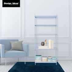 a living room with a blue chair next to a book shelf and a white wall