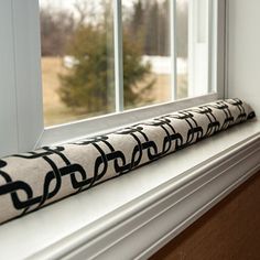 a window sill with a black and white design on it