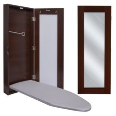 an ironing board, mirror and wooden cabinet are shown in this set - up