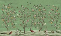 two birds sitting on the branches of trees with flowers and fruit in front of them