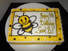 a birthday cake with a happy bee on it