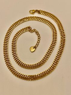 Elevate your style with this stunning 18K gold plated chain necklace. The necklace length of 16 inches makes it a perfect fit for any attire. This piece of jewelry is designed with a unique combination of yellow gold plating and a classic chain style that adds an elegant touch to your look. The necklace is perfect for any occasion and is a must-have addition to your fashion jewelry collection. The necklace comes brand new without tags, making it an ideal gift for your loved ones. Trendy Gold Curb Chain Necklace, Trendy Gold Cuban Link Necklaces, Trendy Gold Cuban Link Chain Necklace, Trendy Yellow Gold Plated Chain Necklace, Gold Chunky Snake Chain Necklace, Stainless Steel Necklace, Gold Plated Chains, Necklace Length, Chain Styles