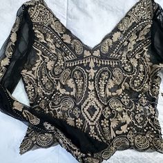 Gorgeous Venus Top. Sheer W/ Embroidery And Beading On The Front. Back Is Also Embroidered No Beading. Slight Bell Sleeves. Cropped Top. Size 6/ Medium. Never Worn. Extra Beads Still Attached. Black Embroidered Formal Tops, Elegant Long Sleeve Embellished Embroidered Fabric, Formal Black Embroidered Tops, Formal Long Sleeve Tops With Intricate Embroidery, Fitted Black Embroidered Top For Festive Occasions, Festive Fitted Black Embroidered Top, Black Embroidered Party Blouse, Elegant Embroidered Evening Tops, Elegant Embroidered Tops For Evening