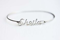 Vintage Name Bracelet - Sheila Silver Metal Name Bracelets, Silver Metal Bracelets With Name Detail, Silver Name Bracelet In Metal, Silver Custom Name Bangle Bracelet, Silver Metal Name Bracelet, Custom Name Silver Bangle Bracelet, Vintage Silver Jewelry With Name Detail, Nickel-free Vintage Bangle As A Gift, Silver Name Bangle Bracelet