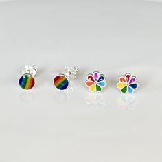 Gay Pride Circle Rainbow Stud Earrings, 925 Sterling Silver Rainbow Earrings. Add color and happiness to your look with these cheerful earrings. You can choose your favorite shape: circle or flower. 📏 Measurements: * Rainbow Circle earring diameter: 5mm // 0.15 in * Rainbow Flower earring diameter: 7mm // 0.27 in 👉🏼Features: * Hypoallergenic. 100% Nickel-free. * Material: genuine 925 Sterling Silver. * You can get them in singles or pairs (both options are offered in the drop-down menu). 🎁 P Rainbow Hypoallergenic Earrings As Gift, Rainbow Nickel-free Earrings For Gifts, Nickel-free Rainbow Earrings Gift, Nickel-free Rainbow Earrings For Gift, Hypoallergenic Rainbow Round Earrings, Hypoallergenic Multicolor Sterling Silver Earrings, Rainbow Sterling Silver Nickel-free Earrings, Nickel-free Rainbow Sterling Silver Earrings, Adjustable Rainbow Sterling Silver Earrings