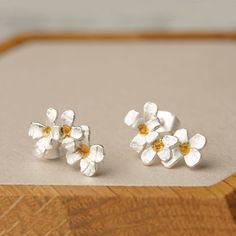 "These tiny flower stud earrings are exquisite and suitable for matching with a dress and skirt. They are also a great fit for matching with simple and casual outdoor wear. Keep your style simple and yet trendy with our flower earrings. This is all you need for that picnic out in the fields, a first dinner date or an evening out with friends. It can also be the perfect accessory for that business outfit or an impromptu meeting with the boss. MATERIAL Sterling Silver SHIPPING Your order will ship Earrings Dangle Simple, Cute Stud Earrings, Silver Flower Earrings, Sakura Flower, Bride Earrings, Flower Stud Earrings, Daisy Earrings, Flower Stud, Birthday Jewelry Gift