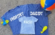 This listing is for two super soft comfy shirts with Mommy and Daddy shark designs and one short sleeve kids T-shirt with a custom personalized name design on it with sharks .  The Womens shirt is available in a dolman style as pictured, crew neck t-shirt or vneck t-shirt.  The Mens shirt is available in a vneck, as pictured or crew neck. Available colors: Black White Charcoal Heather Gray Navy Military Green Pink Red Royal Blue Baby blue Turquiose Mint These tops are true to sizing. Please also Casual Tops With Custom Print For Playtime, Cute Blue Tops For Family Occasions, Customizable Blue Tops For Family Occasions, Fun Blue Tops With Name Print, Fun Blue Top With Name Print, Playful Blue Tops With Name Print, Mommy Shark, Baby Shark Birthday, Mommy And Me Shirts