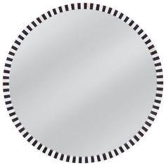 a round mirror with black and white stripes