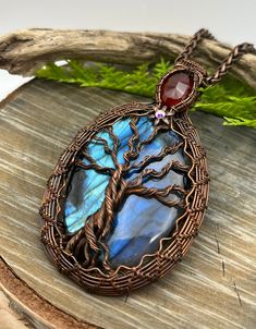 "Big Blue Rainbow Tree of Life Labradorite and Carnelian Gemstone Pendant Necklace with Wire Wrapped Copper, Free USA Shipping, Gift ~ ready to ship~ ~ large luminescent labradorite gemstone, must be seen to truly appreciate this beauty ~ gemstones including a deep faceted orange carnelian are captured in genuine copper handwoven wire ~ antique copper chain adjusts 18\" to 20\" inches length, or convo me your choice if different ~ handmade with skill in the USA! I take great care in designing ea Handmade Spiritual Carnelian Gemstones, Blue Carnelian Spiritual Jewelry, Spiritual Blue Carnelian Jewelry, Handmade Multicolor Labradorite Jewelry, Blue Carnelian Jewelry As A Gift, Blue Carnelian Jewelry For Gifting, Blue Carnelian Jewelry For Gift, Blue Carnelian Jewelry Gift, Handmade Blue Carnelian Jewelry