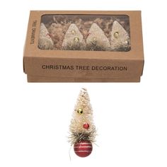 a christmas tree decoration in a cardboard box