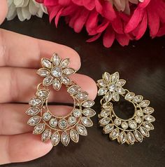 Adorable, effortless minimal and unique! A complete guide to cute outfits and style lover aesthetics❤️ This one is made for a charmer like you with all the love from Noorzaracollection! These beautiful small chandbali earrings in crystal stones m are ready to ship. Color : crystal, champagne Hand crafted and gold plated kundan indian/pakistani jewelry Material:brass,stone,gemstone,pearl We bring you casual as well as party wear jewelry which comes with an attractive design and style. It goes wel Traditional Crystal Party Earrings, Chandbali Chandelier Earrings As Gift, Heavy Bridal Earrings For Eid, Elegant Hoop Earrings With Tilla Details, Traditional Crystal Earrings For Festive Occasions, White Dangle Chandbalis, Diwali Festival Chandbalis Drop Earrings, Bollywood Bridal Chandbali Earrings, Kundan Earrings For Diwali