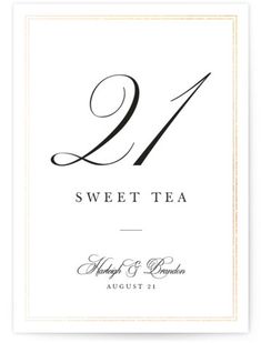 a white table number card with the number twenty nine on it and an elegant calligraphy font