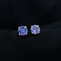 Product Details The Stunning Solitaire Stud Earrings are embellished with the 5 MM Round Shape Tanzanite. Gemstone is studded as Single Stone and prime attraction in a Claw Setting. Solid Gold encasing of Claw Setting around Round Shape Tanzanite make it perfect Jewelry for every occasion. Product Information SKU SHP-EARRINGS052187542 Length 5 mm Width 5 mm Weight 0.80 gm (Approximate) TANZANITE INFORMATION No.of Stones 2 Pieces Total Weight 1.08 Carat (Approximate) Dimension(approx) Round-5X5 m Claw Setting, Solitaire Studs, Tanzanite Gemstone, Single Stone, Earrings In Gold, List Style, Font Size, Round Shape, Round Cut