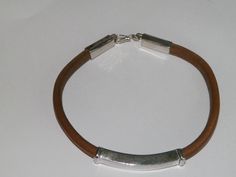 handcrafted natural leather bracelet. Manually shaped natural brown leather with silver elements and hook clasp. It's a very strong and long lasting natural leather bracelet, stamped .925 sterling silver. Length of the bracelet-Up to 22.80 cm/9 inches/ Width of the bracelet-7.79 mm/0.30inches/ Length of the silver element - 43.00 mm/1.69 inches/ Height of the silver element-6.83 mm/0.27 inches/ Length of the end caps+hook clasp-44.56mm(1.75 inches) Pick your size and color: Length: 6inches ,6,5i Leather Bracelet With Palladium Hardware As Gift, Brown Leather Bracelet With Palladium Hardware, Everyday Engraved Brown Leather Bracelet, Everyday Brown Engraved Leather Bracelet, Adjustable Leather Bracelet With Palladium Hardware As Gift, Rectangular Silver Leather Jewelry, Rectangular Silver Leather Bracelet For Everyday, Silver Rectangular Leather Bracelet For Everyday, Everyday Silver Rectangular Leather Bracelet