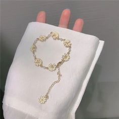 Gold Flower Friendship Bracelet As Gift, Elegant Beaded Bracelets With Flower Charm As Gift, Elegant Flower-shaped Jewelry For Friendship, Delicate White Flower Bracelets, Dainty White Bangle Charm Bracelet, Cute Rose Gold Bracelet Jewelry, Delicate White Bangle Bracelet, Delicate White Friendship Bracelet As Gift, Delicate White Friendship Bracelets As Gift