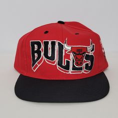 Vintage 90's Chicago Bulls Snapback Hat Red Black GCC Official Licensed NBA. New without tags. Please see photos for more details. Thank you! Red Casual Snapback Hat For Sports Events, Retro Embroidered Logo Snapback Hat For Streetwear, Throwback Snapback Trucker Hat For Sports Events, Throwback Snapback Hat With Curved Brim For Sports, Throwback Snapback Cap For Game Day, Hip Hop Snapback Baseball Cap For Fan Gear, Hip Hop Snapback Baseball Cap For Fans, Throwback Snapback Hat For Sports Events, Red Snapback Hat For Streetwear