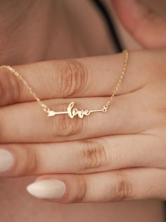 This Love Arrow 14K Gold Necklace promises to be a captivating symbol of your enduring love and passion. Imagine wearing this exquisite piece, a constant reminder of the powerful connection you share with your special someone. Crafted with meticulous attention to detail, this necklace will become a cherished treasure, adding a touch of elegance and romance to any ensemble. The delicate arrow, representing the unwavering strength of Cupid's love, will make this necklace a truly meaningful and ins Symbolic Yellow Gold Jewelry For Valentine's Day, Symbolic Gold Jewelry For Valentine's Day, Symbolic Jewelry For Valentine's Day Anniversary, Meaningful Jewelry For Valentine's Day Anniversary, Symbolic Rose Gold Necklace For Anniversary, Meaningful Jewelry For Anniversary On Valentine's Day, Symbolic Engraved Jewelry For Valentine's Day, Meaningful Jewelry For Anniversary Gift On Valentine's Day, Meaningful Jewelry For Anniversary And Valentine's Day