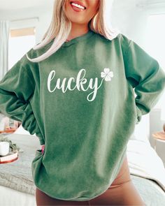 "Get ready to sham-rock your St. Patrick's Day celebration with our vibrant and super cute Lucky Sweatshirt! This shirt blends comfort with Irish charm, featuring a simplistic design that captures the spirit of the festivities. Crafted with soft, high-quality fabric, it's perfect for parades, classroom crawls, or simply spreading the luck of the Irish wherever you go. Embrace the green and let the good times roll with our Lucky shirt - your go-to attire for a day filled with laughter, cheer, and a touch of Irish magic!\" 🍀🌈 .: 80% ring-spun cotton, 20% polyester .: Medium-heavy fabric (9.5 oz /yd² (322.1 g/m .: Relaxed fit .: Sewn in twill label" Green Relaxed Fit Cute Sweatshirt, St. Patrick's Day Cotton Crew Neck Tops, Cotton Crew Neck Top For St. Patrick's Day, Cute Green Sweatshirt With Letter Print, Everyday Green Sweatshirt With Graphic Print, Green Graphic Print Sweatshirt For Everyday, Everyday Green Graphic Print Sweatshirt, Sham Rock, Lucky Shamrock