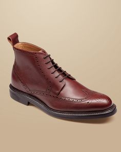 Upper: leather, Lining: 100% leather, Flexible rubber sole, Goodyear welted construction, EVA foam filler moulds to your foot, Specialist shoe care products - Leather Brogue Boots - Chestnut Brown | Men's Charles Tyrwhitt Brogue Boots - Chestnut Brown Size 11 Leather Classic Brown Wingtip Chukka Boots, Brown Classic Chukka Boots With Brogue Detailing, Classic Cognac Boots With Leather Footbed, Classic Goodyear Welted Boots With Round Toe, Masculine Wingtip Boots With Leather Sole, Classic Cognac Boots With Leather Sole, Goodyear Welted Leather Lace-up Shoes, Classic Wingtip Chukka Boots With Leather Footbed, Brown Chukka Boots With Goodyear Welt And Almond Toe