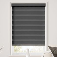 the blinds in this room are gray and black