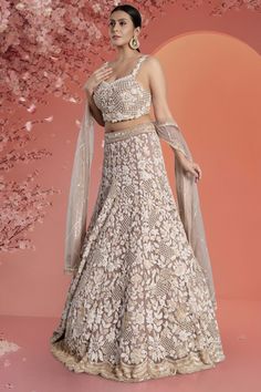 Unleash your daring spirit with our Bridal Lehenga BL-341! Stand out at any function with this rosybrown lehenga featuring striking white pearls and shimmering gold sequin work. Perfect for adding a touch of adventure to your special day! Fabric: Net with Satin silk lining! WASH CARE INSTRUCTIONS - Please Dry clean only when it is applicable! Ready to Ship! Rosy Brown, Satin Silk, Gold Sequin, Silk Satin, Pearl White