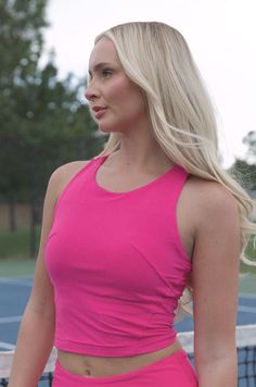 Stay comfortable while you work up a sweat in this stylish pink workout top! Featuring a soft and lined fabric and a racerback design, it will provide you with superior breathability and comfort. Plus, the built-in bra insert provides extra coverage and support. So, you can stay focused on achieving your fitness goals in this butter soft tank. butter soft crop length sport top 84% poly microfiber 16% spandex true to size model is wearing a small Racerback Tank Top With Built-in Padding And 4-way Stretch, Sporty Stretch Tank Top With Built-in Padding, Sporty Tops With Built-in Bra For Sports, Stretch Sportswear Tank Top With Built-in Padding, Pink Fitted Activewear With Built-in Padding, Sporty Racerback Tank Top With Built-in Padding, Stretch Tank Top With Built-in Padding For Light Exercise, Athleisure Tank Top With Built-in Bra For Light Exercise, Racerback Top With Built-in Bra For Workout