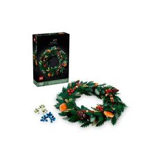 a christmas wreath and other decorations in front of a box