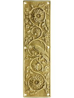 an ornate gold door handle with a bird on it