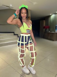 a woman in neon clothing posing for the camera