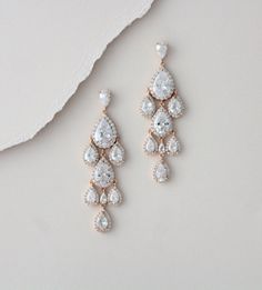 "Beautiful cascading waterfall teardrop earrings are a perfect accessory for bride or bridesmaid. Created with Swarovski Pure Brilliance stones in 3 different finishes. Available in rhodium, rose gold and yellow gold Earrings measure 2-1/2\" x 7/8\" Matching pieces: https://www.etsy.com/listing/674474135/rose-gold-bridal-bracelet-teardrop?ref=shop_home_active_1&pro=1&frs=1 https://www.etsy.com/listing/273104988/rose-gold-necklace-bridal-necklace?ref=shop_home_active_33 https://www.etsy.c Glamorous Rose Gold Dangle Chandelier Earrings, Rose Gold Dangle Chandelier Earrings, Rose Gold Dangle Bridal Earrings, Rose Gold Dangle Chandelier Earrings For Formal Events, Rose Gold Drop Bridal Earrings, Rose Gold Drop Bridal Earrings For Anniversary, Glamorous Drop Chandelier Earrings For Wedding, Glamorous Wedding Drop Chandelier Earrings, Drop Chandelier Earrings For Wedding