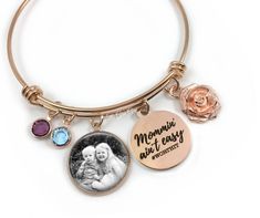 "This rose gold stainless steel wire bangle bracelet comes with an engraved charm that says \"Mommin' ain't easy #worthit\" as well as a 2nd charm that will feature your photo - and to top it off, a rose charm and birthstone for each of your kids! Choose 1 to 6 birthstones. Terrific gift for your mom for Mother's Day or Birthday. TO SEND PHOTO After ordering, please send us an Etsy convo and attach your photo. Or, you can email your photo to littlegemgirl@hotmail.com. If you email your photo, pl Wire Bangle Bracelets, Rose Gold Charms, Wire Bangles, Photo Necklace, Photo Charms, Gold Charm Bracelet, Gifts For Your Mom, Birthstone Charms, Crystal Charm