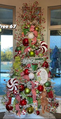 a christmas tree decorated with candy canes and ornaments