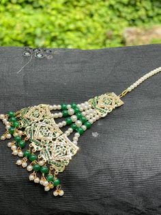 Gold - plated  jadhau  maang tikka with Green colour stone ,has  green pearls .. Material:-Brass Stone type:-pearls  Plating:-Gold -plated Jaipur Jewelry, Hair Jewellery, Colour Stone, Maang Tikka, Green Pearls, Green Colour, Brown Kraft, Body Jewellery, Hair Jewelry