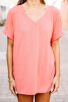 This versatile v-neck tee is here to make your life easy! It's honestly the perfect top for year round styling and layering. You can knot the hem or half tuck into your favorite jeans or shorts. You can layer it with all sorts of jackets, shackets, or kimonos. And don't even get us started on accessories! The options are absolutely endless! This top is truly a staple piece! This top features a v neckline, short cuffed sleeves, and a generous fit.Material has generous amount of stretch. Sydney is Relaxed Fit V-neck Top For Summer Loungewear, Summer Cotton V-neck Top, Versatile V-neck T-shirt For Loungewear, Casual Cotton V-neck Top For Summer, Summer Cotton V-neck T-shirt, Summer Cotton T-shirt With V-neck, Spring Everyday V-neck Top, Summer V-neck Top For Loungewear, Summer V-neck Top For Loungewear With Relaxed Fit