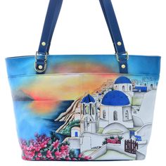 Busy day ahead? Take this Anuschka tote along for the ride! No matter where your plans take you, this large sized tote bag has all the space you could possibly need. It closes with a secure zip top design and houses plenty of pockets for organization. Featuring Anuschka's hand-painted leather designs, you'll love toting this artsy double handle bag along with you! Artistic Large Capacity Shoulder Bag For Travel, Artistic Tote Shoulder Bag For Travel, Hand Painted Shoulder Bag For Travel, Hand Painted Tote Shoulder Bag For Daily Use, Hand Painted Tote Shoulder Bag For Everyday, Everyday Hand Painted Tote Shoulder Bag, Daily Use Hand Painted Tote Shoulder Bag, Blue Hand Painted Shoulder Bag For Travel, Artistic Blue Shoulder Bag For Travel