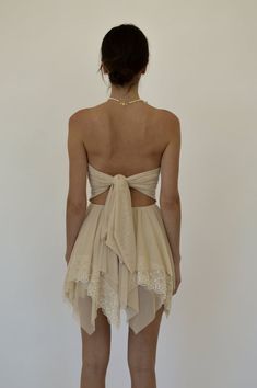 Chic Lace Tube Top For Summer, Chic Lace Summer Tube Top, Chic Summer Tube Top For Prom, Summer Bandeau Dress With Boned Bodice, Cream Corset Dress For Summer Parties, Cream Summer Corset Dress For Parties, Beige Stretch Backless Dress, Lace Dress With Sheer Back And Backless Design, Summer Strapless Bandeau Dress With Boned Bodice