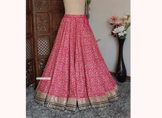 Made to Order/Made to Measurement/Custom Made Indian Lehenga Skirt (PLEASE NOTE THIS IS SKIRT ONLY) - Fabric: Embroidered Silk - Color : Hot Pink - Fully Flared Paneled (kalidaar) skirt  - Lined - Can Can attached - Embroidered Border - Drawstring with beautiful  latkan This is Made To Order and we require following measurements in inches. 1. Waist of Skirt 2. Length of Skirt PLEASE NOTE: BUYERS ARE RESPONSIBLE FOR ANY CUSTOMS AND IMPORT TAXES THAT MAY APPLY. Fabric Care : Dry Clean Only Disclai Fitted Bottoms With Resham Embroidery For Wedding, Embroidered Full Skirt For Wedding, Festive Skirt With Cutdana For Reception, Festive Cutdana Skirt For Reception, Traditional Wedding Skirt With Intricate Embroidery, Fitted Embroidered Bottoms For Wedding, Fitted Wedding Skirt With Intricate Embroidery, Anarkali Skirt With Resham Embroidery, Resham Embroidered Bottoms For Wedding And Festivals