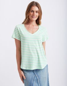 DESCRIPTION Add a fresh burst of colour to your wardrobe with the Neon Vee Tee in neon green by White & Co The Label. This tee boasts neon green stripes on a crisp white background, giving it a vibrant yet laid-back appeal. The flattering V-neckline and short sleeves create a relaxed, comfortable fit that's perfect for casual days. The lightweight fabric makes it ideal for warmer weather, while the stylish cover stitch detail down the centre back adds a stylish touch to this everyday essential. Interview Outfit Men, Vacation Outfits Men, Prom For Guys, Interview Outfits Women, Prom Suits For Men, Vacation Outfits Women, Linen Shirt Men, Stripe Tee, Prom Suits